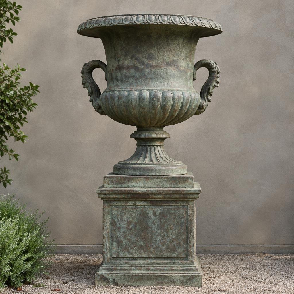 Large antique cast iron garden urn with weathered green patina